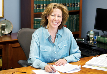 Tami S.P. Beach at her desk in her Eugene office